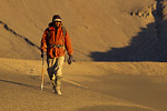 Photo: Johan Reinhard climbs the barren landscape of Nevado Ampato