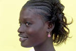Photo: Woman in front of yellow wall